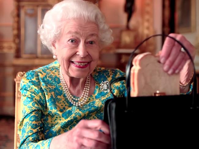 Queen Elizabeth II has died at age 96  - The Queen and Paddington Bear enjoy a maamalade sandwich during the Platinum Party at the Palace for the 70th Jubilee. Supplied