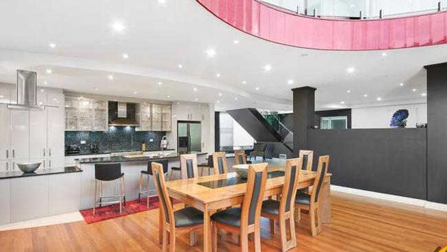 The stylish kitchen includes blue pearl granite benchtops.