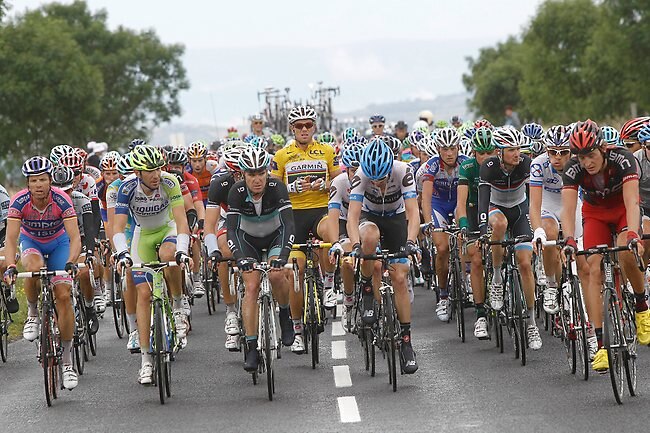 <p>Thor Hushovd, wearing the overall leader's yellow jersey, sits up in the bunch during the ninth stage.</p>