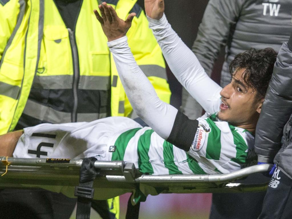 CelticÕs Daniel Arzani goes off injured during the Scottish Premiership match at Dens Park, Dundee.. Picture date: Wednesday October 31, 2018. See PA story SOCCER Dundee. Photo credit should read: Jeff Holmes/PA Wire. EDITORIAL USE ONLY