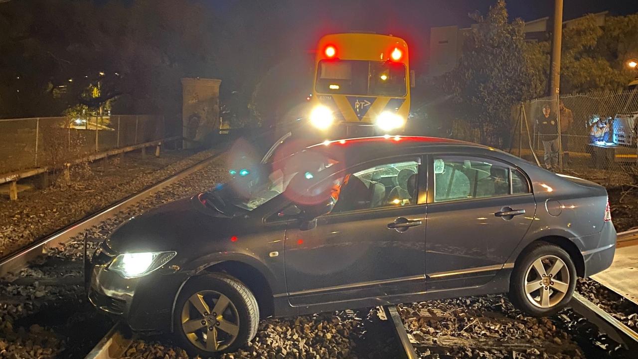 Essendon drink driver: Car gets stuck on tracks, almost hit by train ...