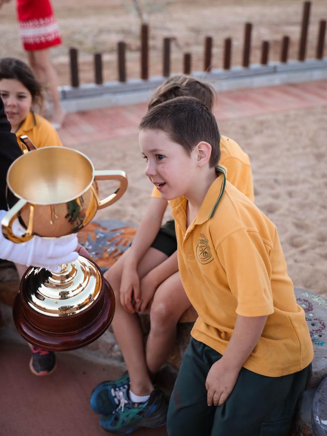 Schoolchildren admire the Melbourne Cup in Muttaburra, Queensland.