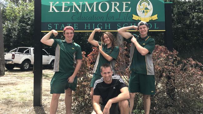 Kenmore State High School chaplain Justin Prestidge with students Thomas Saxby, Phaedra Keefe and Douglas Dover. The principal has urged parents and students not to participate in a P&amp;C uniform survey.