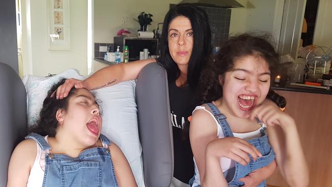 Danielle Phelps is fighting to keep her disabled children Jordyn, 21 (left) and Juliana, 18 (right) at Croydon Specialist Developmental School. Picture: Kiel Egging.