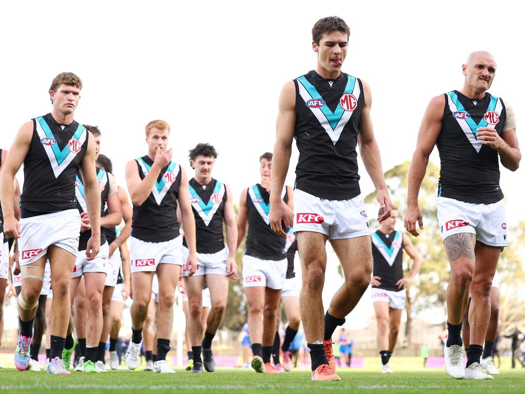 Connor Rozee leads the Power off the ground after Saturday’s loss. Picture: Morgan Hancock/Getty Images