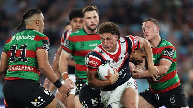 SYDNEY, AUSTRALIA - SEPTEMBER 06:  Mark Nawaqanitawase of the Roosters is tackled during the round 27 NRL match between South Sydney Rabbitohs and Sydney Roosters at Accor Stadium, on September 06, 2024, in Sydney, Australia. (Photo by Matt King/Getty Images)