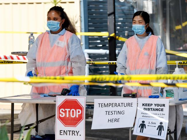 A temperature checking and hand sanitiser station is seen at the entrance of the Sydney Fish Market in Sydney, Friday, April 10, 2020. More than 40,000 people attend the market on Good Friday ahead of the Easter weekend, but this year only 400 people will be allowed on the site at one time, with people being asked to follow social distancing rules in the market to limit the spread of COVID-19.(AAP Image/Bianca De Marchi) NO ARCHIVING