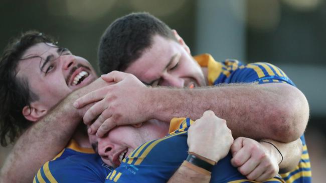 Toukley players celebrate after the full-time whistle. Picture: Sue Graham