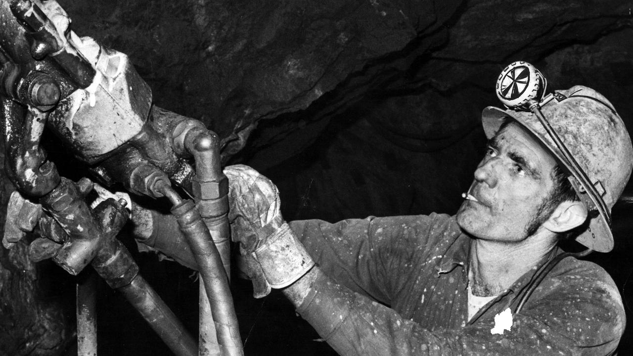 A Kambalda miner pictured in 1976 drills for nickel ore at 244m below the Nullarbor surface in WA.