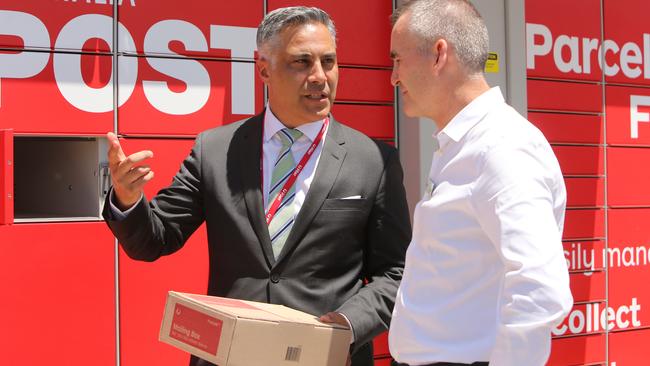 Australia Post CEO Ahmed Fahour and Woolworths boss Brad Banducci. Picture: Stuart McEvoy