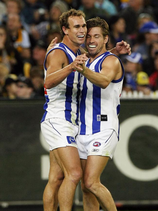 Corey Jones is embraced by teammate Shannon Grant during his seven-goal salvo.