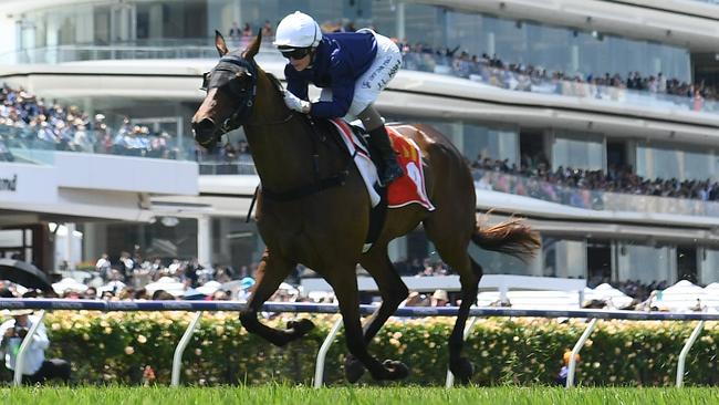 Jamie Kah guides The Map to a dominant win at Flemington on Melbourne Cup day. Picture: Quinn Rooney-Getty Images