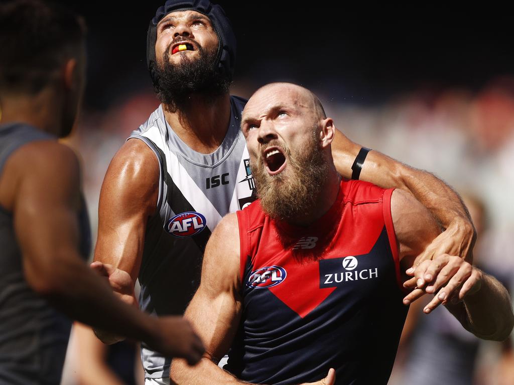 Paddy Ryder of the Power and Max Gawn of the Demons contest the ruck during the Round 1 AFL match between the Melbourne Demons and the Port Adelaide Power at the MCG in Melbourne, Saturday, March 23, 2019. (AAP Image/Daniel Pockett) NO ARCHIVING, EDITORIAL USE ONLY