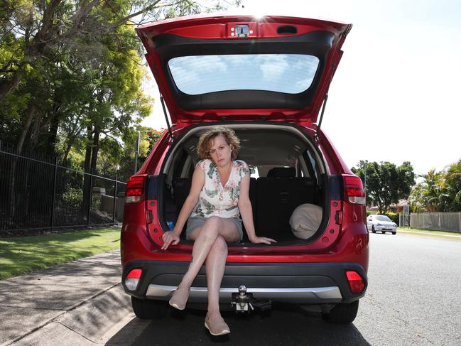 Trish Harris outside her Coomera home with her car. Picture: Glenn Hampson.