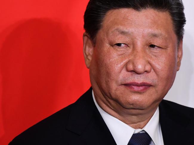 China's President Xi Jinping looks on during a signing ceremony of partnership agreements following a meeting with Italy's prime minister at Villa Madama in Rome on March 23, 2019 as part of a two-day visit to Italy. (Photo by Alberto PIZZOLI / AFP)