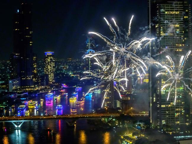 New Year's Eve fireworks erupt over the Chao Phraya river during the fireworks show in Bangkok on January 1, 2021. Picture: AFP