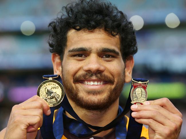 Hawks legend Cyril Rioli poses with his premiership and Norm Smith Medal after the 2015 AFL Grand Final. Picture: Michael Dodge/AFL Media/Getty Images