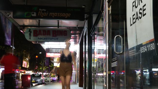 Pedestrian crossing Darlinghurst Road outside the Tabou nightclub at night,  Kings Cross 1961