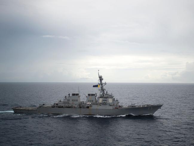 (FILES) In this file photo taken on October 21, 2016, the guided-missile destroyer USS Decatur (DDG 73) operates in the South China Sea as part of the Bonhomme Richard Expeditionary Strike Group (ESG). - An American warship has sailed through waters off the contested Spratly Islands in the South China Sea, in the latest implicit challenge to Beijing's sweeping territorial claims in the region, the Pentagon said Sunday, September 30, 2018. "Guided-missile destroyer USS Decatur conducted a freedom of navigation operation," an official told AFP. "Decatur sailed within 12 nautical miles of Gaven and Johnson reefs in the Spratly Islands." The official said all US military operations in the area "are designed in accordance with international law and demonstrate that the United States will fly, sail and operate wherever international law allows." The 12-mile distance is commonly accepted as constituting the territorial waters of a landmass.  Beijing claims all of the Spratly chain. There was no immediate reaction from China, but a similar US operation in July, involving the disputed Paracel islands, prompted a furious Beijing to deploy military vessels and fighter jets. (Photo by Petty Officer 2ndClass Diana QUINLAN / Navy Media Content Operations (N / AFP) / RESTRICTED TO EDITORIAL USE - MANDATORY CREDIT "AFP PHOTO / US NAVY/Petty Officer 2nd Class Diana Quinlan" - NO MARKETING NO ADVERTISING CAMPAIGNS - DISTRIBUTED AS A SERVICE TO CLIENTS