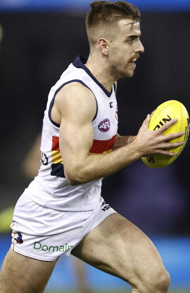 Jordan Gallucci of the Crows runs with the ball. (AAP Image/Daniel Pockett)