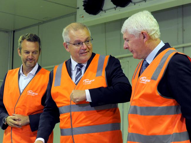 The then-prime minister, Scott Morrison with CSL executive Simon Buensch and Dr McNamee, at the company’s Melbourne facility in 2021. Picture: Andrew Henshaw