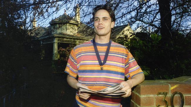 Essendon’s Gavin Wanganeen wearing his Brownlow Medal outside his home in Melbourne the day after his win. Picture: Fiona Hamilton