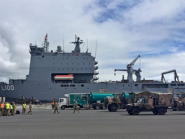 Vehicles and equipment loaded on-board HMAS Choules in Brisbane ahead of relief efforts. Picture: AFP/Australian Department of Defence