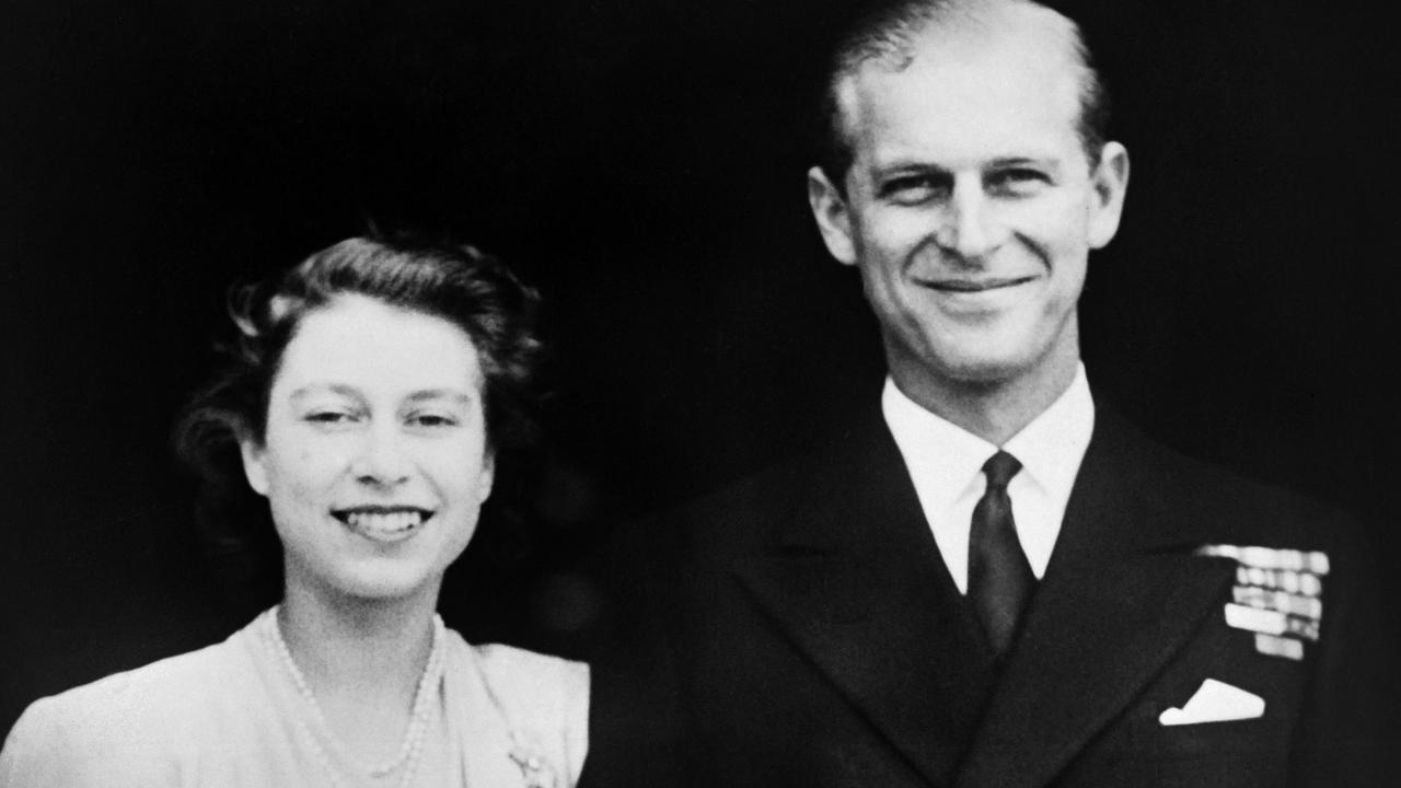 Then Princess Elizabeth and Philip of Greece posing on the day of their engagement, in July 1947, outside Buckingham Palace in London.