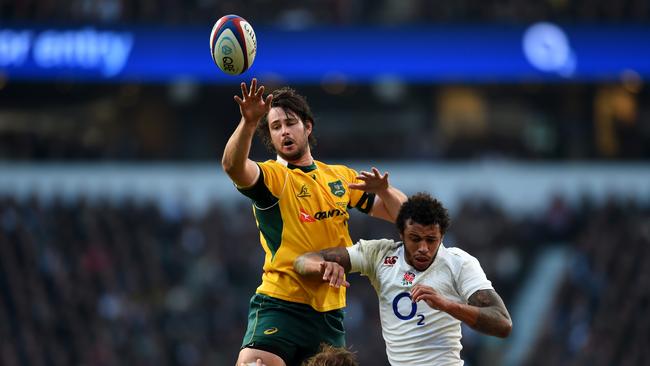 Sam Carter of Australia wins the lineout under pressure from Courtney Lawes of England.