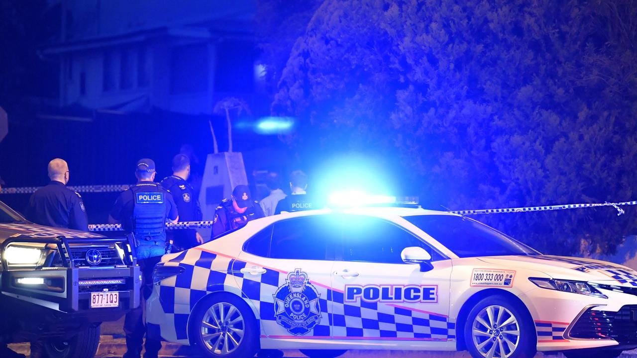 Police outside a North Toowoomba home on Sunday night where a man was shot by officers after a tense standoff.