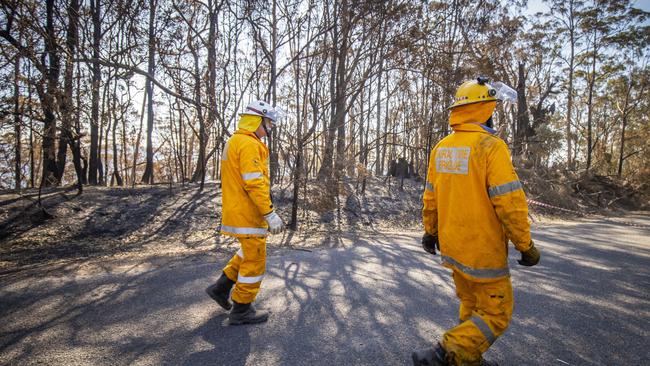 Firefighters on the ground at Timbarra Dr, Binna Burra on Thursday. Picture: AAP Image/Glenn Hunt