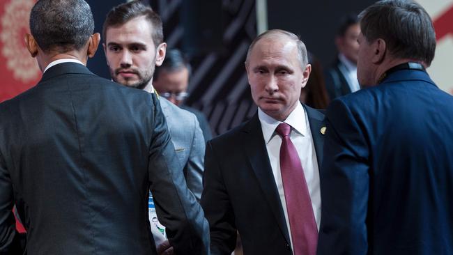 An icy stare and a brisk handshake for Obama and Putin.