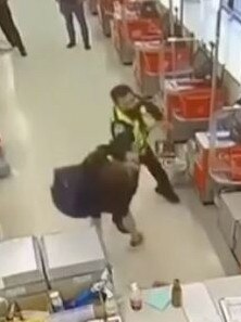 The security guard slaps the customer across the face, knocking him backwards. Picture: 7 NEWS