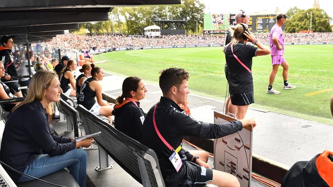 The Herald Sun’s Lauren Wood watches the AFLW decider from the Carlton bench. Pic: AAP/ Keryn Stevens