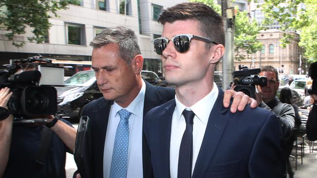 Benjamin Fitt (right) leaves the court. Picture: AAP Image/David Crosling