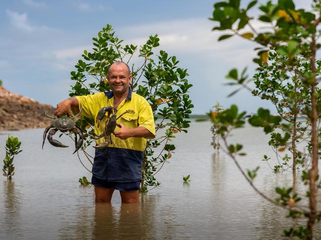 The big Wet has meant that crab fishos are excited for a bumper season of mud crab. Bradley Roe is looking forward to getting knee deep in the mud. Photograph: Che Chorley