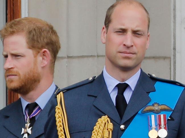 (FILES) In this file photo taken on July 10, 2018 Britain's Prince Harry, Duke of Sussex, (L) and Britain's Prince William, Duke of Cambridge (R) stand on the balcony of Buckingham Palace on July 10, 2018 to watch a military fly-past to mark the centenary of the Royal Air Force (RAF). - Princes William and Harry on January 13, 2020 put on a rare joint front to dismiss a "false story" speculating about their relationship, as senior royals met for talks about the younger brother's future. "For brothers who care so deeply about the issues surrounding mental health, the use of inflammatory language in this way is offensive and potentially harmful," they said. (Photo by Tolga AKMEN / AFP)