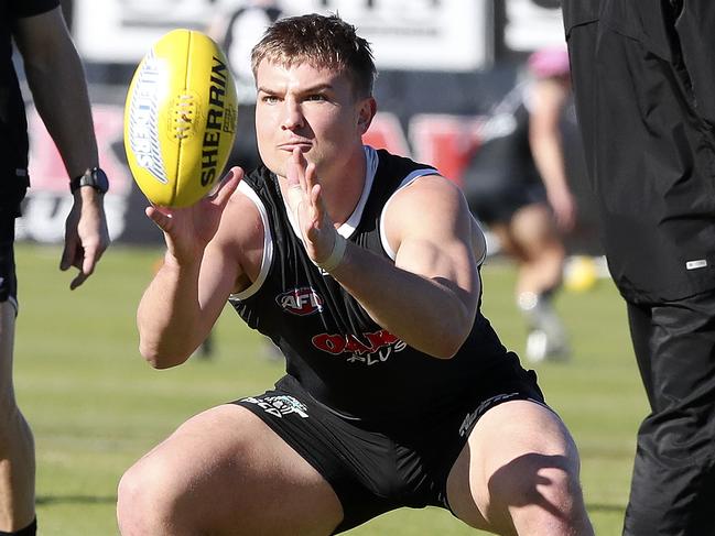 Power co-captain Ollie Wines keeps his eyes on the ball during Port Adelaide’s Wednesday training session at Alberton Oval. Picture: Sarah Reed