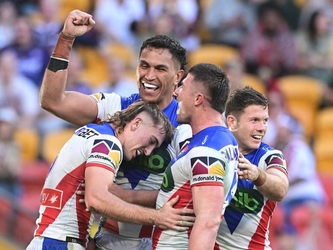 BRISBANE, AUSTRALIA - MAY 03: Fletcher Sharpe of the Knights celebrates with team mates after scoring his third try during the round nine NRL match between the South Sydney Rabbitohs and Newcastle Knights at Suncorp Stadium on May 03, 2025, in Brisbane, Australia. (Photo by Bradley Kanaris/Getty Images)