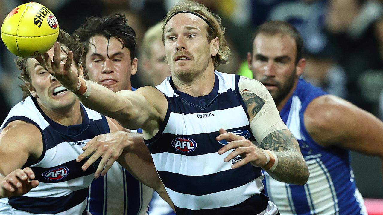 GEELONG, AUSTRALIA - APRIL 18: Tom Stewart of the Cats looks to get the ball during the round five AFL match between the Geelong Cats and the North Melbourne Kangaroos at GMHBA Stadium on April 18, 2021 in Geelong, Australia. (Photo by Robert Cianflone/Getty Images)