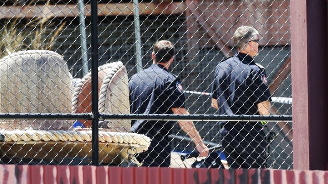 Police at Dreamworld the day after 4 people died on the Thunder River Rapids ride. Photo Steve Pohlner