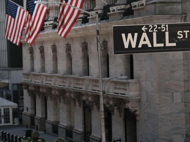 NEW YORK, NEW YORK - NOVEMBER 24: The New York Stock Exchange (NYSE) stands in lower Manhattan on November 24, 2020 in New York City. As investor's fear of an election crisis eases, the DowJones Industrial Average passed the 30,000 milestone for the first time on Tuesday morning.   Spencer Platt/Getty Images/AFP == FOR NEWSPAPERS, INTERNET, TELCOS & TELEVISION USE ONLY ==