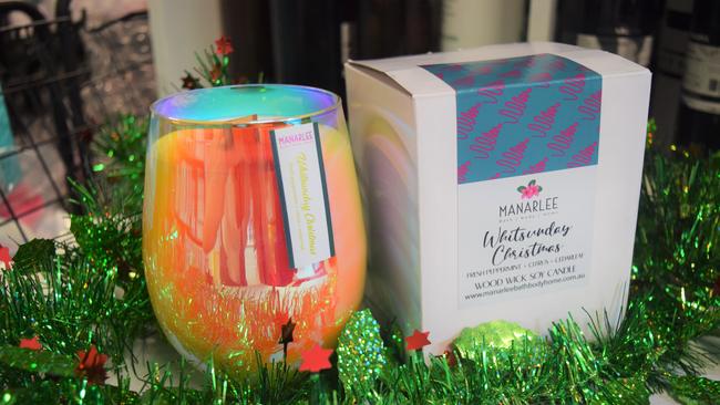 Manarlee stocks a range of Christmas gifts, including a candle capturing the festive season in the Whitsundays. Picture: Laura Thomas