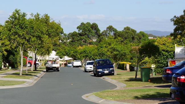 One of the many narrow streets in North Lakes, where residents have taken to parking on their front lawns.