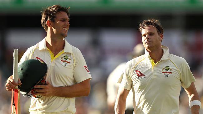 Australia’s Mitchell Marsh (left) and Steve Smith leave the WACA Ground field after a big day of runs on Saturday.