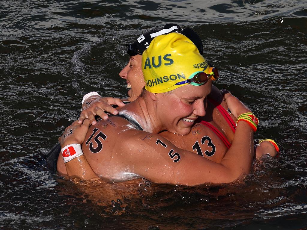 Moesha Johnson of Team Australia and Ginevra Taddeucci of Team Italy embrace after their marathon swim final. Picture: Clive Rose/Getty Images