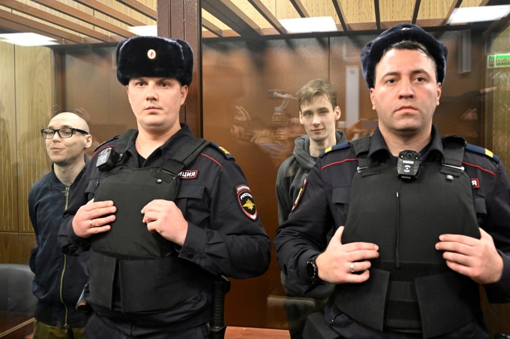 Two Russians get prison terms for poetry against Ukraine campaign