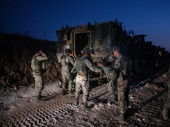 The first group of Turkish infantry prepare to enter Syria on the border between Turkey and Syria. Picture: Getty Images