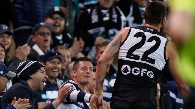 Geelong fan Kurt Maitland said he gave Charlie Dixon a ‘bit of a serve’ when the Power big came flying over the fence. Picture: Michael Willson/AFL Photos