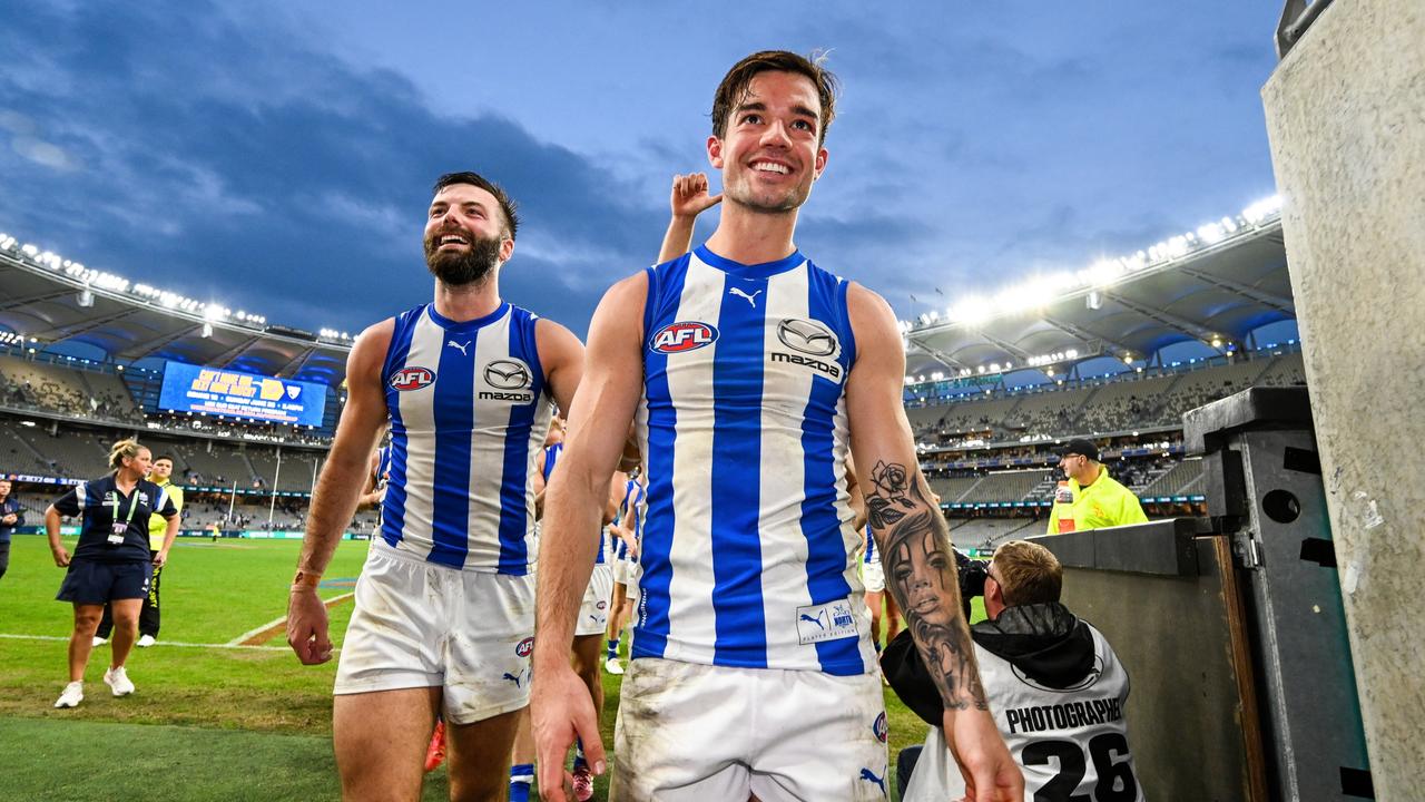 Jy Simpkin of the Kangaroos leads his team to the rooms after the win. (Photo by Daniel Carson/AFL Photos via Getty Images)